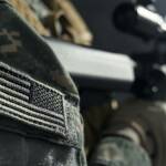 Stripe of American flag on clothes of soldier.