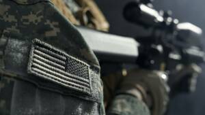 Stripe of American flag on clothes of soldier.