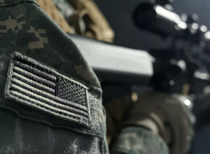 Stripe of American flag on clothes of soldier.